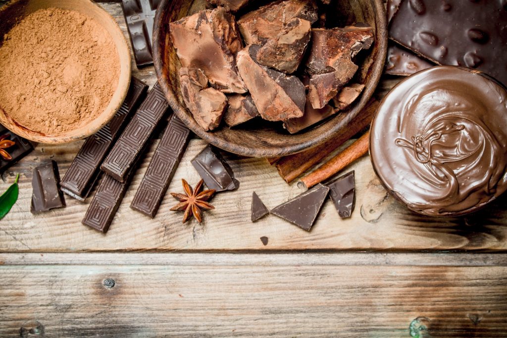 Chunks of crushed chocolate with chocolate paste and ground cocoa.